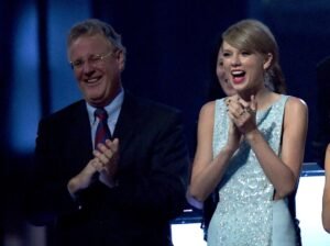 This image is about Taylor Swift and Scott Swift