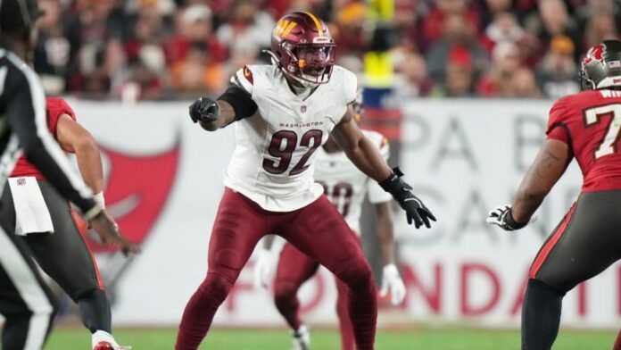 This image is about Jonathan Allen, Washington Commanders defensive lineman, in action.
