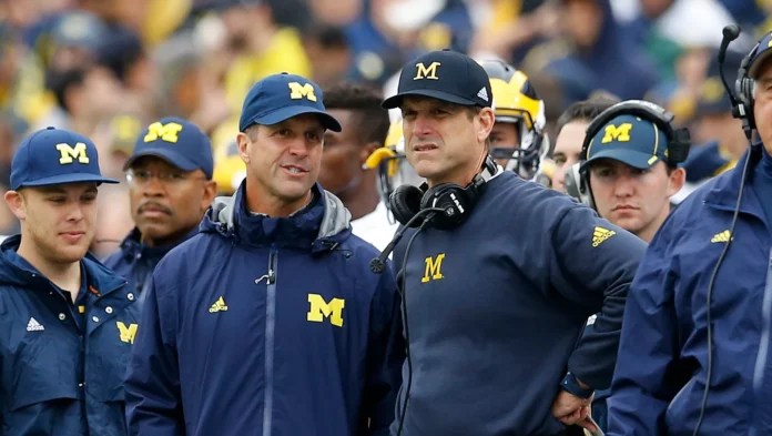 This image is about John Harbaugh and he's talking to his teammates
