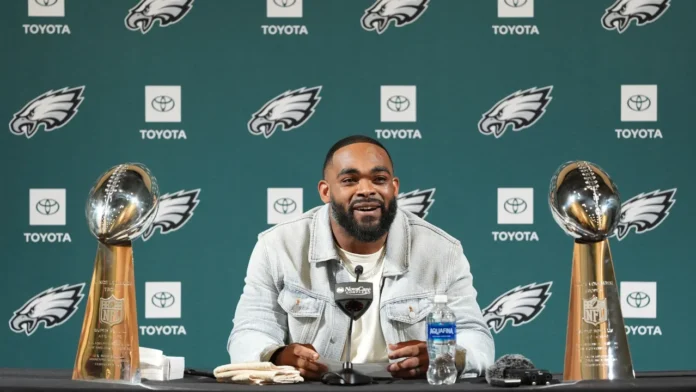 This image is about Brandon Graham at an Eagles press conference with two Lombardi trophies.