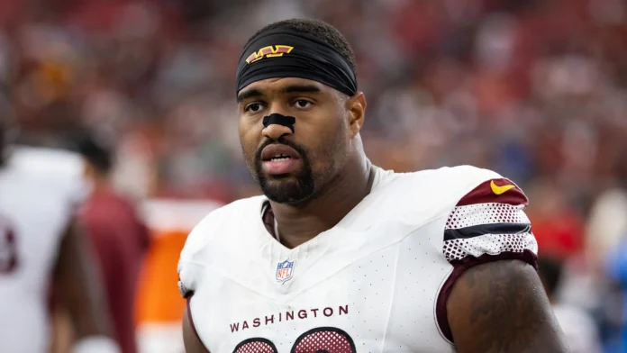 This image is about Jonathan Allen, Washington Commanders defensive lineman, during an NFL game.