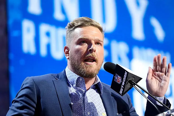 This image is about Pat McAfee (Sports Analyst) giving speech