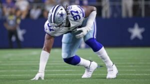 This image is about "Osa Odighizuwa, Dallas Cowboys defensive lineman, in action."