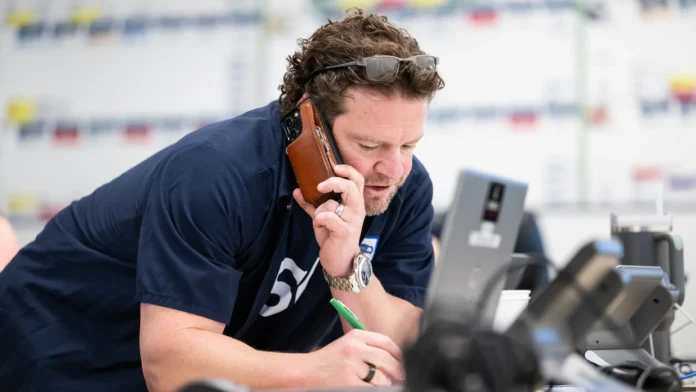 This image is about John Schneider, speaking on call